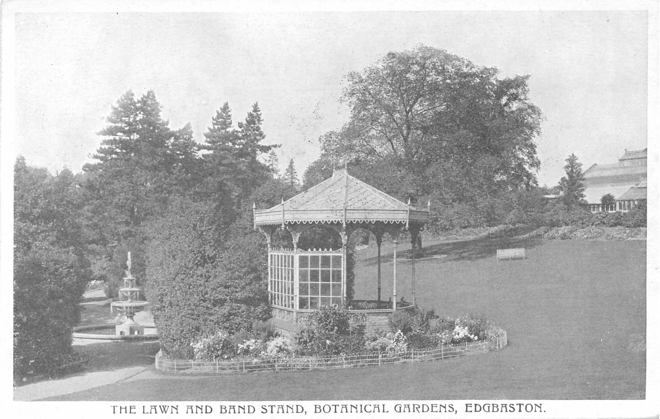 A black and white photo of the bandstand and fountain